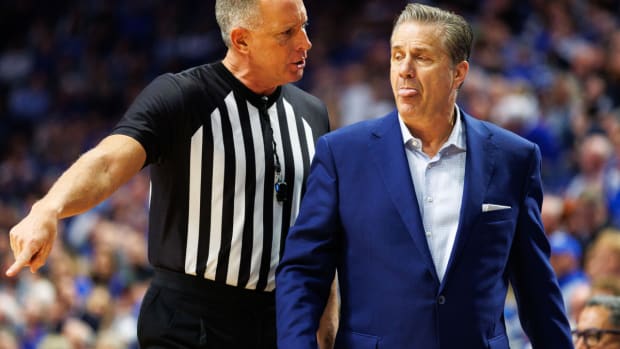 Jan 31, 2024; Lexington, Kentucky, USA; Referee Don Daily speaks with Kentucky Wildcats head coach John Calipari during the second half between the Kentucky Wildcats and the Florida Gators at Rupp Arena at Central Bank Center. Mandatory Credit: Jordan Prather-USA TODAY Sports